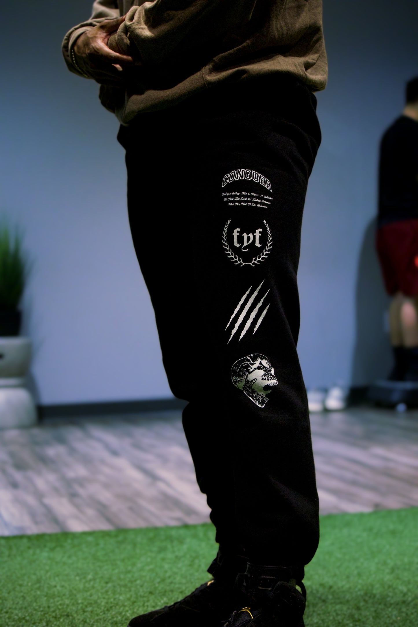 "LEAVE OUR MARK" Joggers in Black